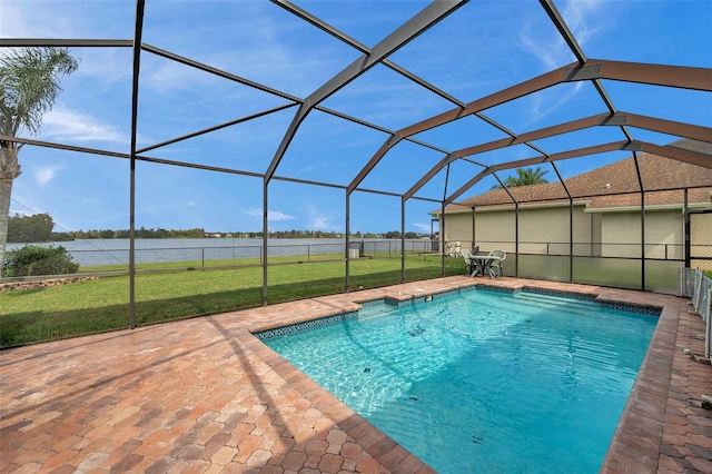 view of pool with a water view, a patio area, a lanai, and a yard