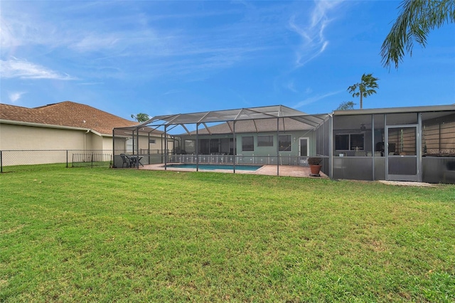 view of yard featuring a patio and glass enclosure