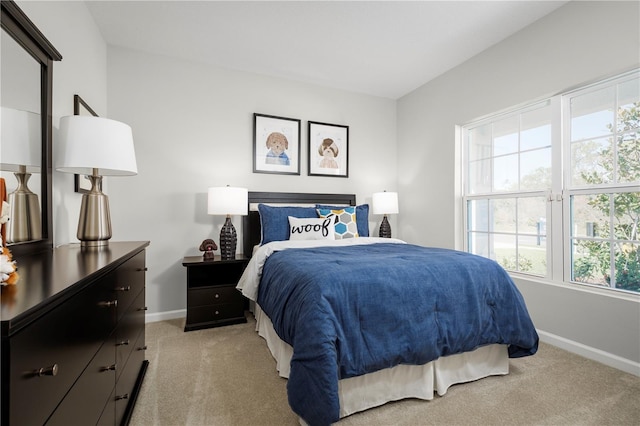 bedroom with light carpet