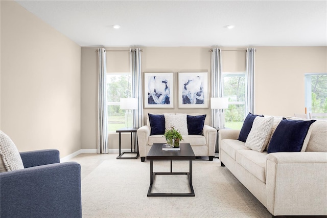 carpeted living room with plenty of natural light