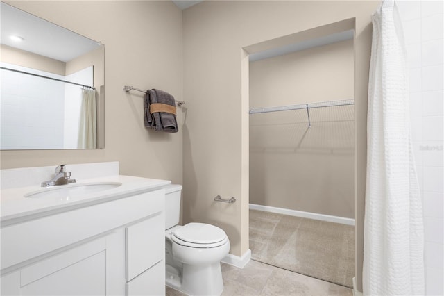 bathroom featuring vanity, toilet, curtained shower, and tile patterned flooring