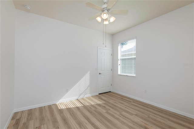 unfurnished room featuring light wood-type flooring and ceiling fan