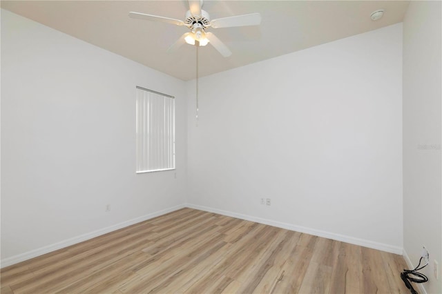 empty room with light hardwood / wood-style flooring and ceiling fan