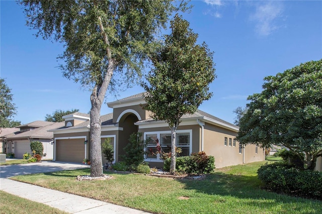 view of front of home featuring a front yard and a garage