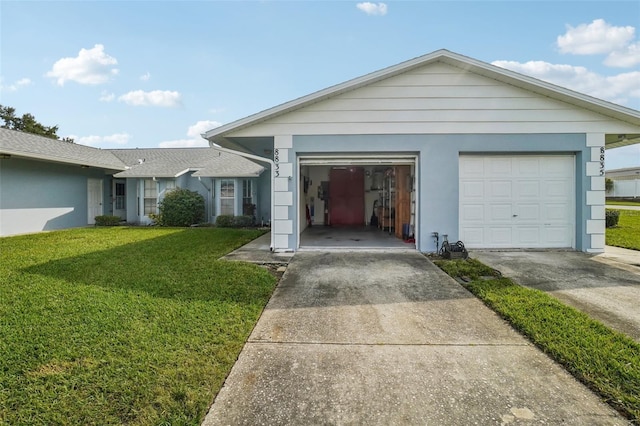 ranch-style home with stucco siding, concrete driveway, and a front lawn