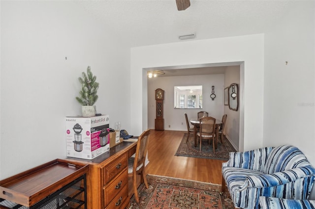 interior space featuring ceiling fan and wood finished floors