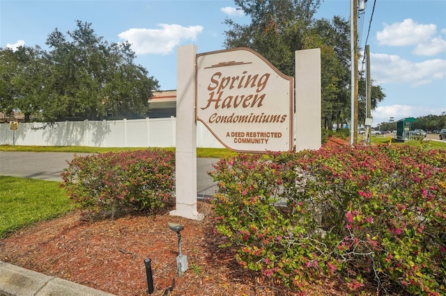 community sign featuring fence