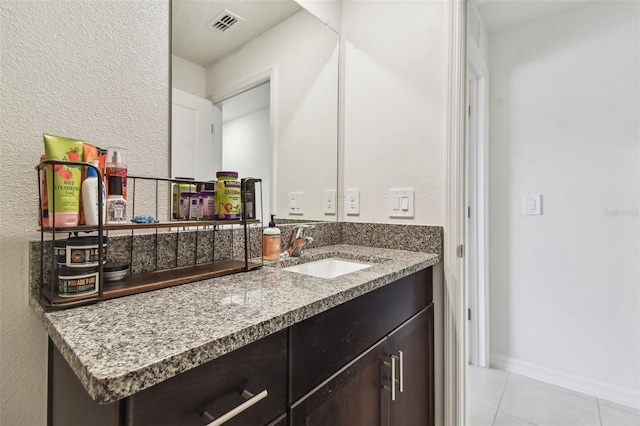 bathroom with vanity and tile patterned floors