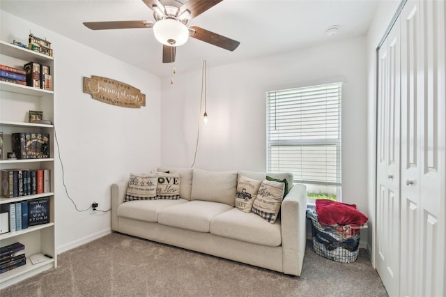 living room with carpet flooring, ceiling fan, and plenty of natural light