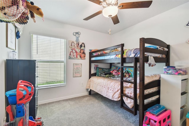 bedroom with ceiling fan and carpet floors