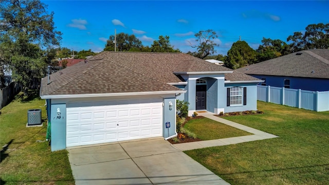 ranch-style house featuring a front lawn and a garage