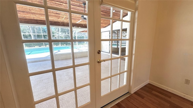 entryway featuring hardwood / wood-style flooring, a healthy amount of sunlight, and french doors