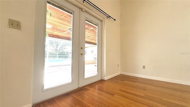 doorway to outside with french doors and light hardwood / wood-style floors