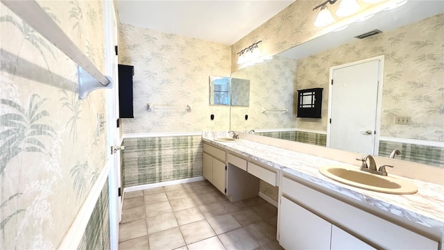 bathroom featuring tile patterned floors and vanity