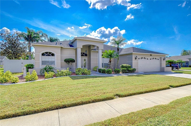 view of front of home with a front lawn and a garage