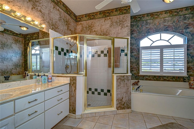 bathroom featuring vanity, ceiling fan, shower with separate bathtub, and tile patterned flooring