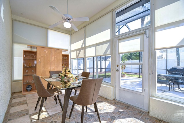 dining room featuring a healthy amount of sunlight and ceiling fan