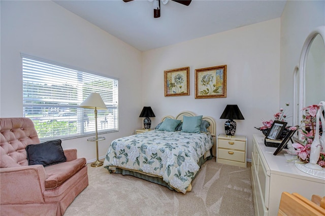 carpeted bedroom with ceiling fan and lofted ceiling