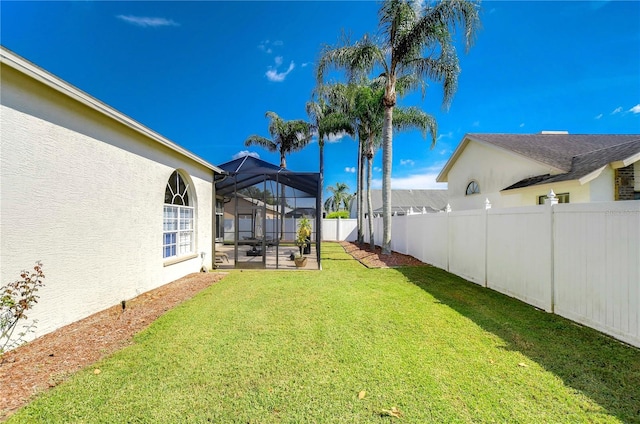 view of yard with a patio area and a lanai