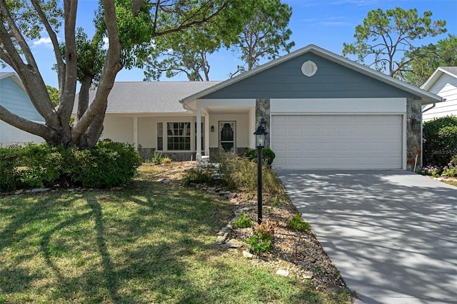 ranch-style home with a garage and a front lawn