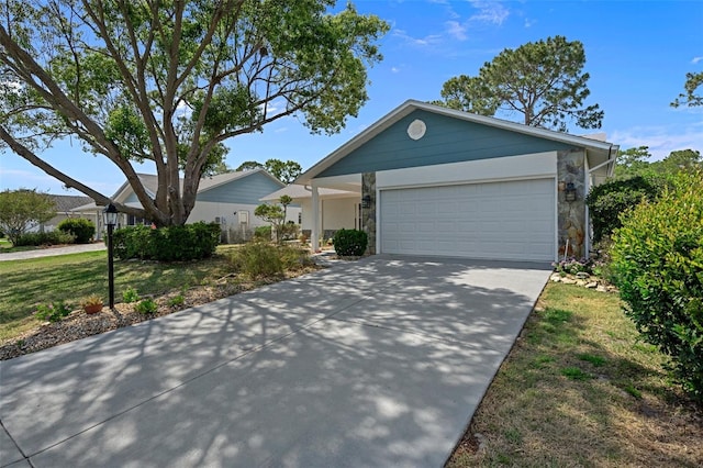 ranch-style home with a front yard and a garage