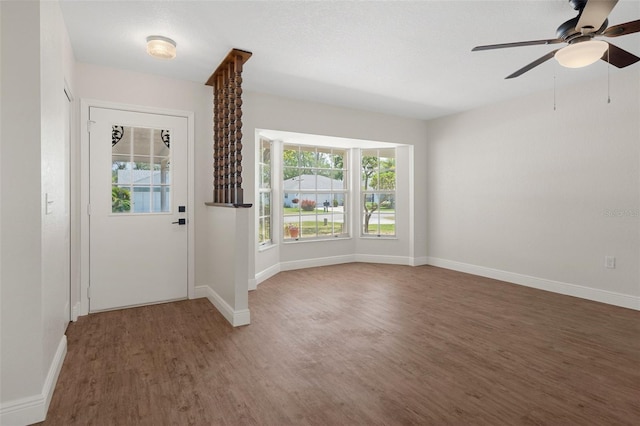 foyer entrance featuring ceiling fan and dark hardwood / wood-style floors