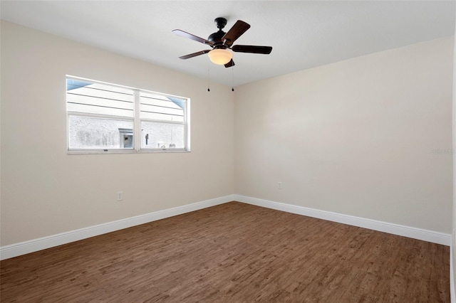 unfurnished room featuring dark hardwood / wood-style floors and ceiling fan