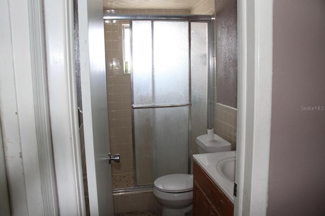 7204 Westcott Dr, Port Richey, FL 34668 - full bathroom featuring a shower stall, vanity, and toilet