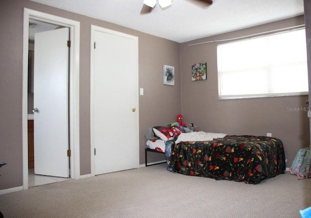 carpeted bedroom with ceiling fan