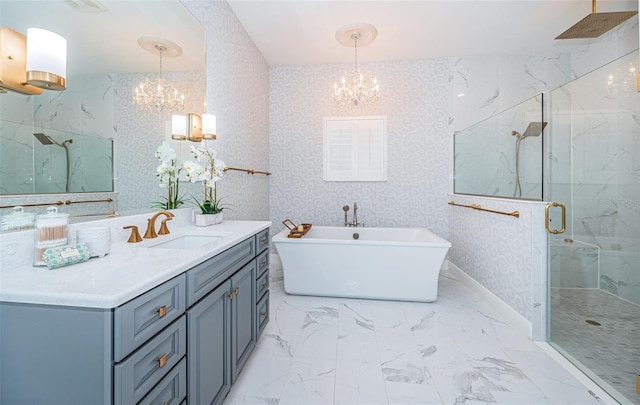 bathroom with vanity, independent shower and bath, and a chandelier