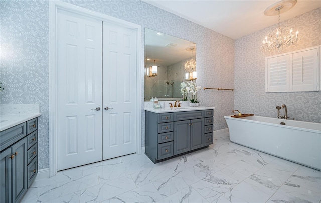 bathroom with vanity, independent shower and bath, and a chandelier