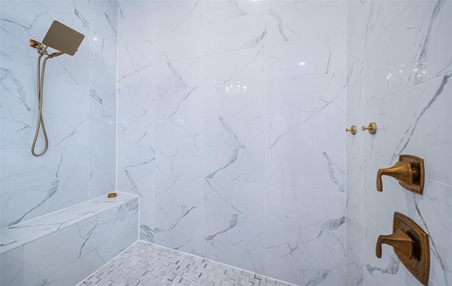 bathroom with a tile shower