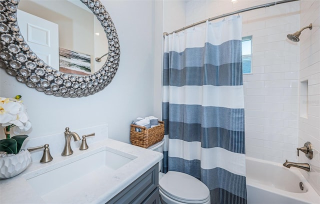 full bathroom featuring vanity, shower / tub combo with curtain, and toilet