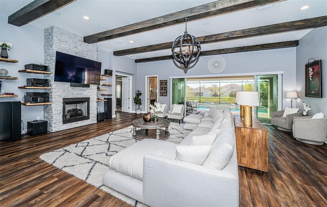 living room featuring beamed ceiling, a stone fireplace, and dark hardwood / wood-style flooring