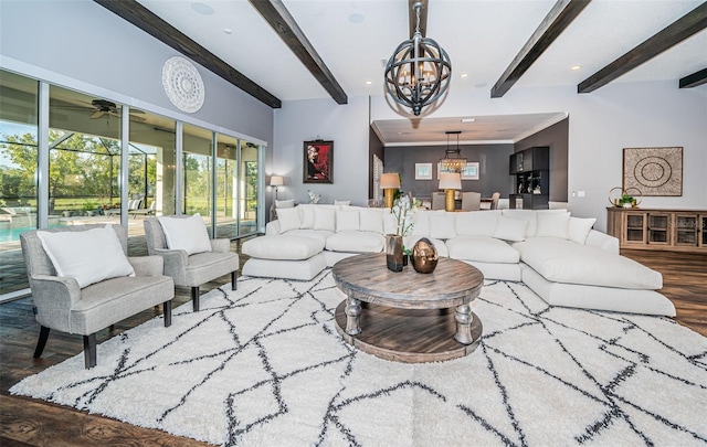 living room with beamed ceiling, ornamental molding, a chandelier, and hardwood / wood-style floors