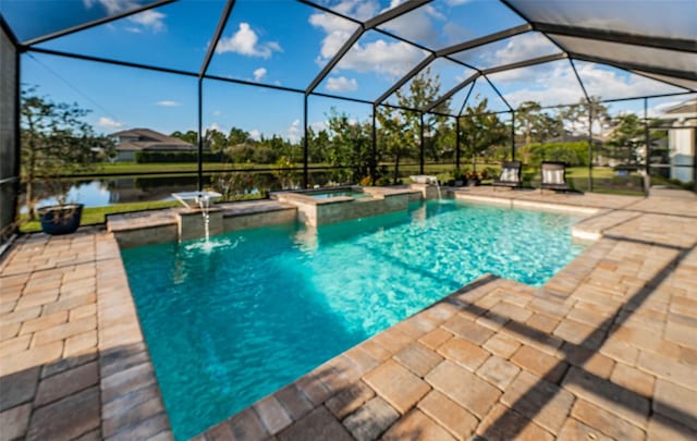 view of pool featuring an in ground hot tub, a patio area, glass enclosure, pool water feature, and a water view