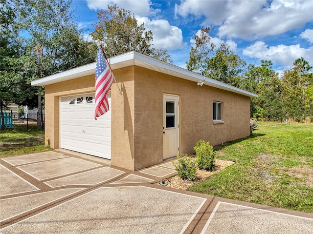 garage featuring a yard