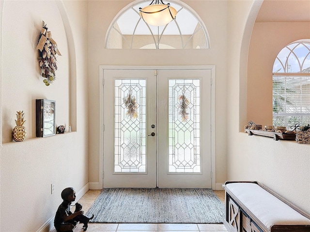 tiled foyer entrance with french doors