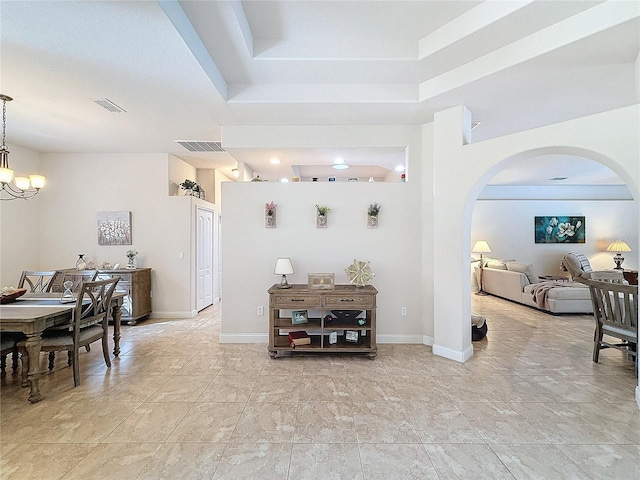 interior space with decorative light fixtures and a notable chandelier