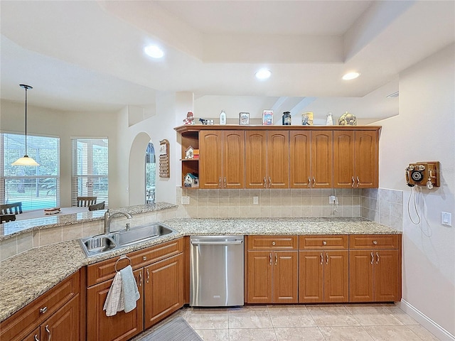 kitchen with decorative backsplash, sink, light tile patterned floors, and decorative light fixtures