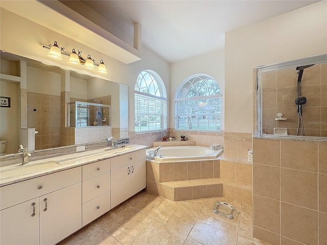 full bathroom with separate shower and tub, tile patterned flooring, vanity, and toilet