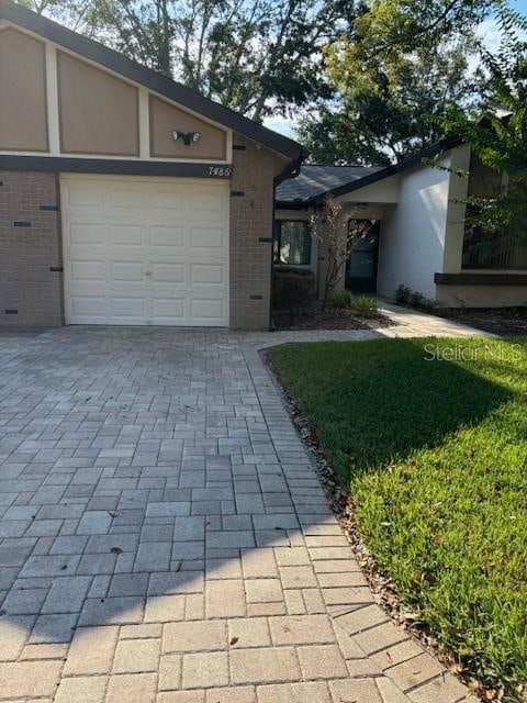 single story home featuring a garage