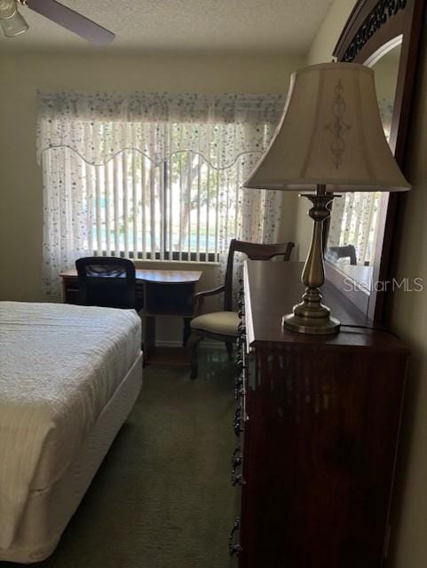 bedroom featuring ceiling fan and carpet floors