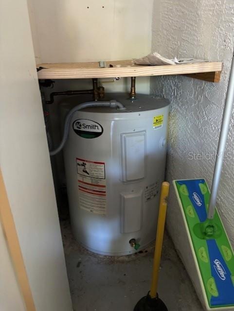 utility room with water heater