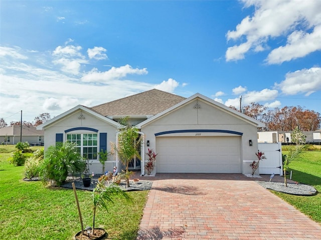 single story home with a front lawn and a garage