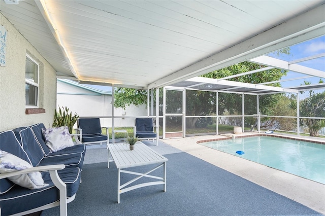 view of swimming pool with a patio and glass enclosure