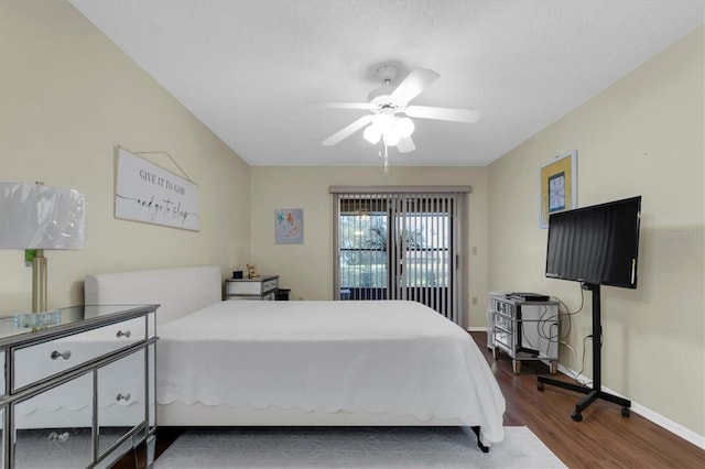 bedroom featuring dark wood-type flooring and ceiling fan