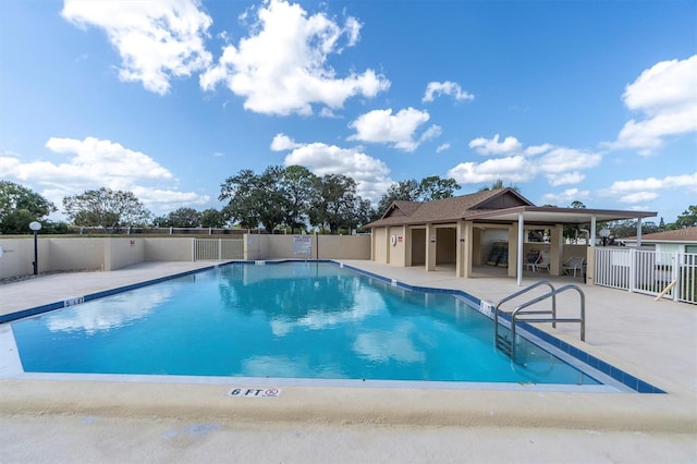 view of swimming pool with a patio area