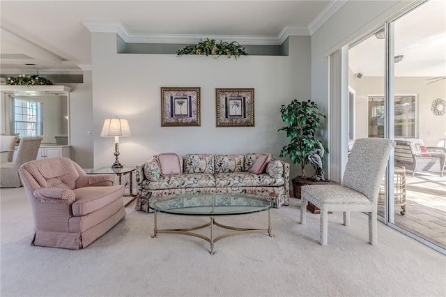 living room with ornamental molding, carpet flooring, and ceiling fan