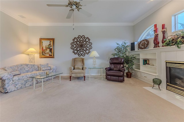 sitting room featuring crown molding, a fireplace, light colored carpet, and ceiling fan